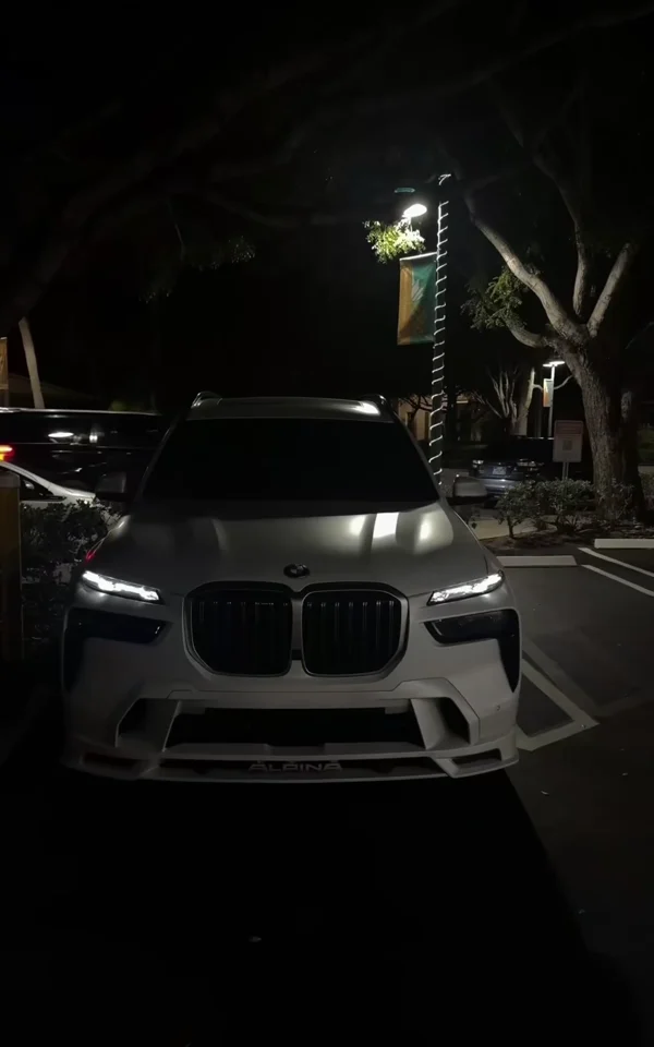 A luxury car at night, from the second supplied lifestyle video.